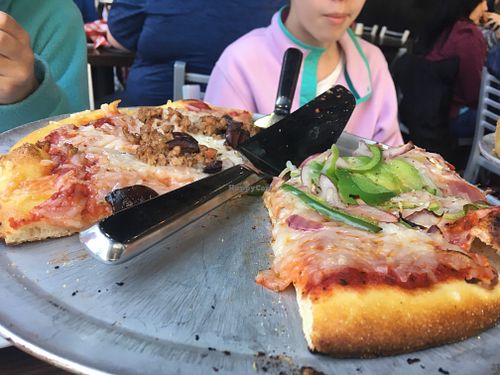Vegan half and half thin crust pizza with Daiya, various veggies, and amazing vegan Italian sausage at Pi Pizzeria - Downtown in St Louis