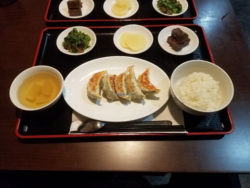 Gyoza set containing Gyozas, rice, veggi soup, pickled radish, a salad containing brokkoli and sea weed, and a five spice mochi type of thing - very yummy. at Ren - Nakagyo Ward in Kyoto