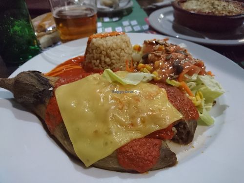 Stuffed aubergine with rice, nuts, vegan cheese at Canadu in Malaga