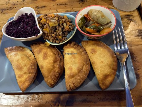 Vegan empeñadas with three bowls f "garnishes". at El Vegetariano de la Alcazabilla in Malaga
