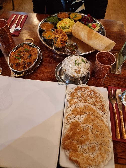 Foreground: Appam, Herbed Kathrika Vazhattiyath (Aubergine curry) at Herb Restaurant in Leicester