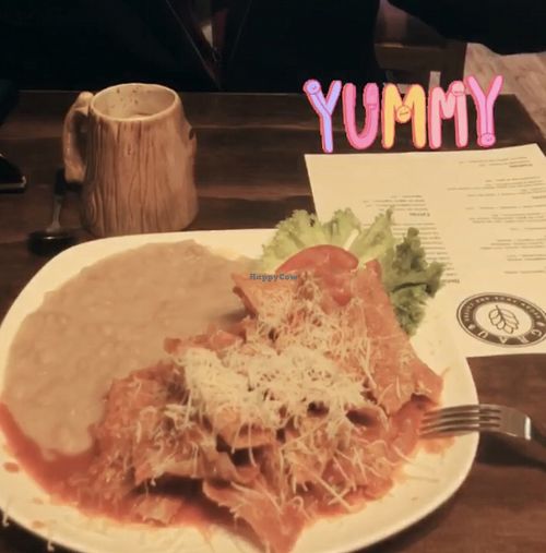 Red chilaquiles with canellini beans at Grau Vegan in Chihuahua