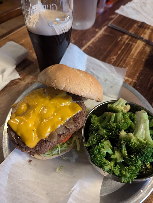 Impossible burger with vegan cheese, sauteed mushrooms and onions. Side of sauteed broccoli at Lavergne's Tavern in Berwyn