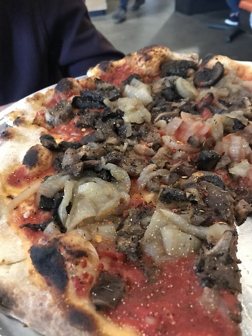 Mushroom pizza with red sauce at Mas Kaos in Denver