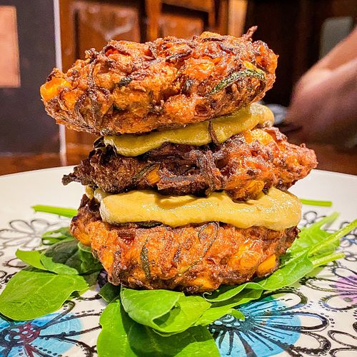 sweetcorn and chickpea fritters with smashed avocado and spinach at Hillhead Bookclub in Glasgow