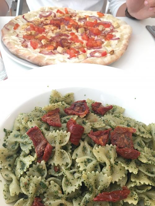 Pesto pasta and gyros pizza at Veganeria in Budapest