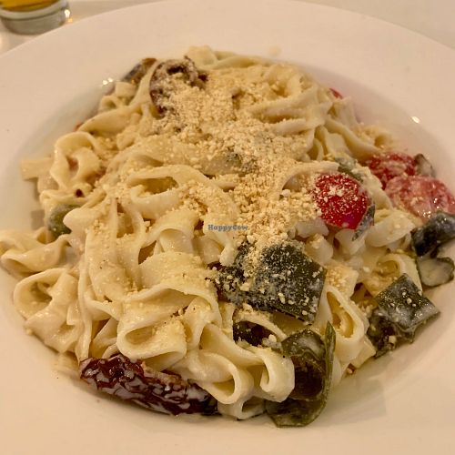 Tagliatelle with dried tomatoes, algae, capers and cashew Parmesan  at Veganeria in Budapest