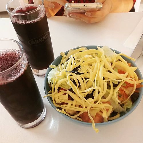 Blueberry juice, salad bow ? with vegan cheese at Veganeria in Budapest