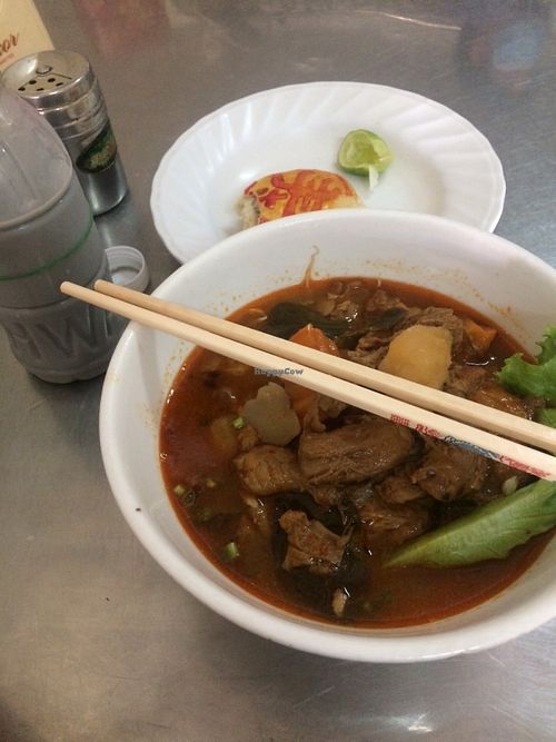 Spicy soup, soy bean milk, and a taro cake  at Ahaa Boer Vegetarian Food in Battambang