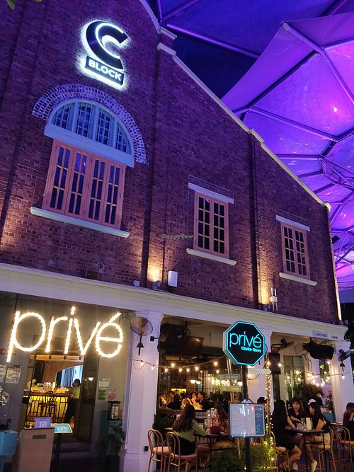 Main entrance and alfresco dining area at Prive - Clarke Quay in Central Singapore