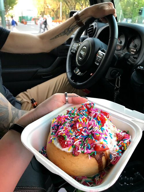 Birthday cake cinnamon bun with strawberries.  at Cinnaholic - 109 St in Edmonton