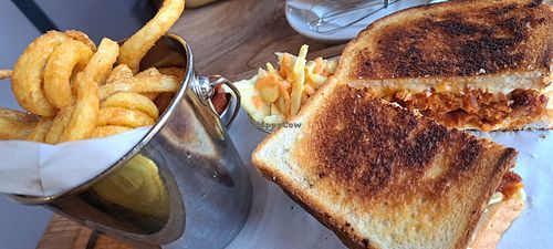 Vegan grilled cheese with seitan and curly fries at Brooklyn Cafe in Glasgow