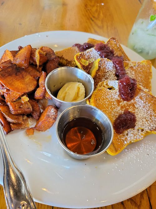 Turmeric French toast with breakfast potatoes  at Flore in Los Angeles