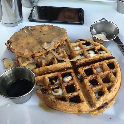 Delicious vegan chik'n and waffles with mushroom gravy over potatoes at Flore in Los Angeles