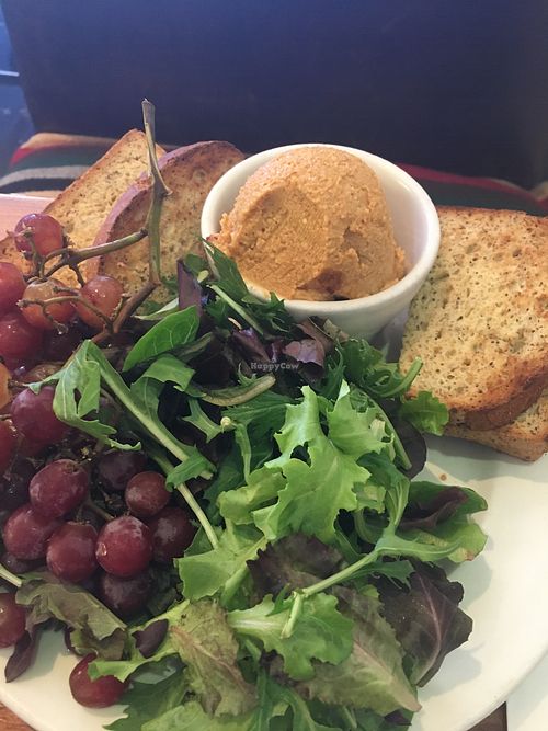 $14 cheese plate-ball of plain ground cashews, dry lettuce and grapes  at Flore in Los Angeles