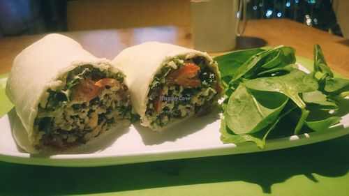 Vegan wrap with brown rice, kale, black beans, cherry tomatoes, mushrooms and spicy cashew dressing. Recommended :) at Squirrel in South West London