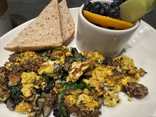 Bee-spoke scramble with v goetta, tofu scramble and added spinach, back beans and garlic herb!  at Sleepy Bee Cafe - Downtown in Cincinnati