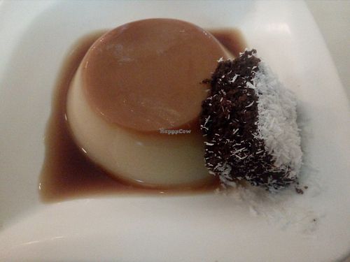 Flan and chocolate coconut cake at Loving Hut in Valencia