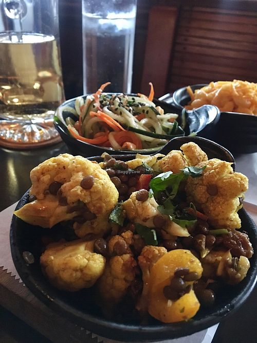 Curried lentil cauliflower with the cucumber salad and Mac and cheese in the background at Chappaqua Station in Chappaqua