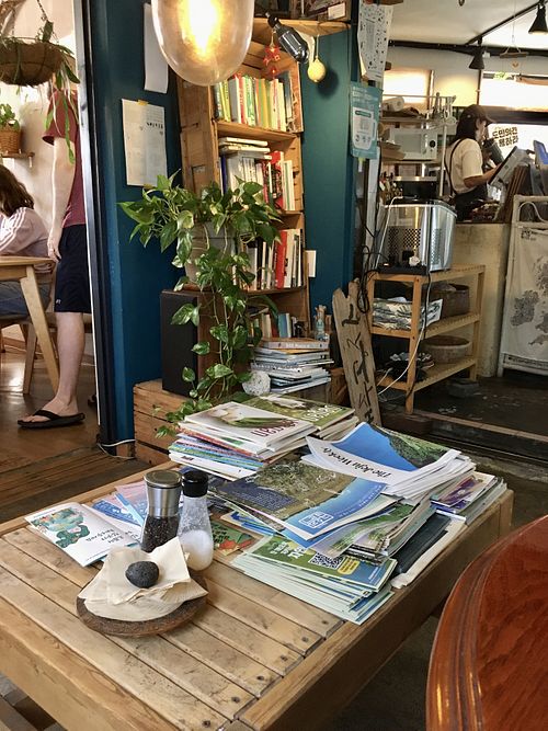 Cozy seating with vegan literature   at And 유 (Yu) Cafe in Jeju