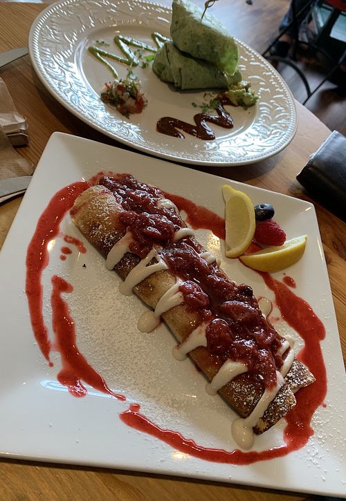 Vegan crepes (strawberry/lemon) and vegan breakfast burrito. at Caffrodite Community Collective in Ventura