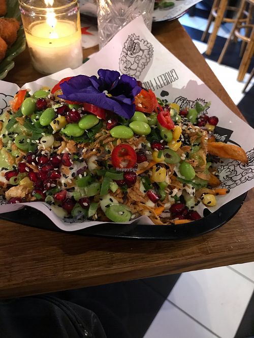 Bottom of this dish has sweet potato fries at Vegan Junk Food Bar - Eastside in Amsterdam