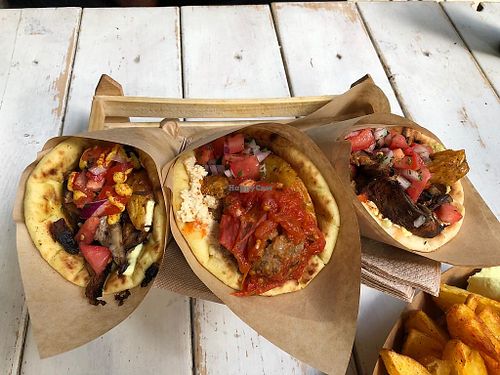 Yellow, red and kebab pitas, and potatoes at Cookoomela Grill in Athens