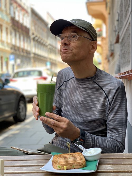 Awokado tosty, green smoothie with a straw made of corn. at Vegano Cafe in Krakow