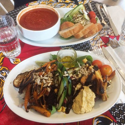 Himmelsk sallad (roasted veggies, sprouts, hummus) and Soup of the Day; tomato served with salad and bread.   at Atmajala in Norrtalje