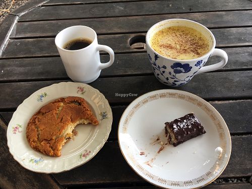 choc chip cookie, raw bounty bar, coffee & golden milk. at Hermans in Stockholm