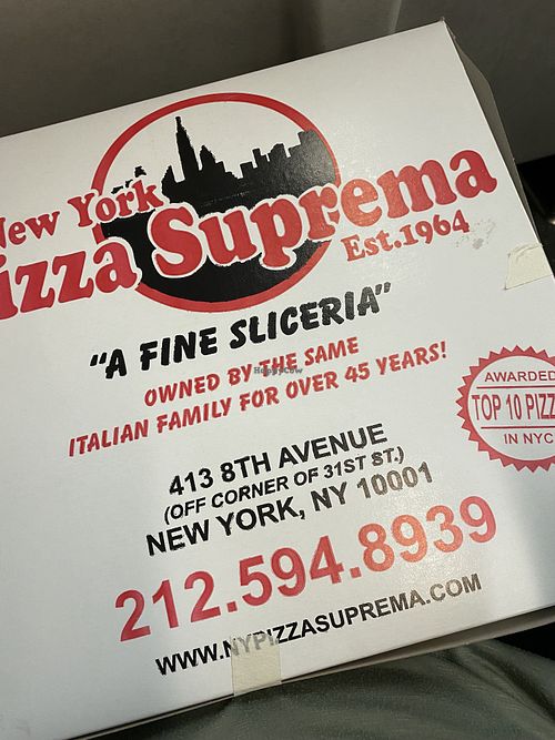 They wrapped up my three slices nicely! at NY Pizza Suprema in New York City