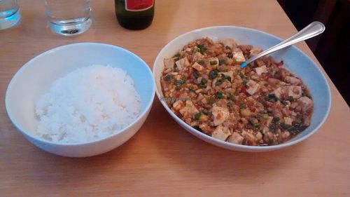 Spicy Sichuan tofu dish made with chili bean sauce, garlic, ginger, spring onions, vegetarian minced “meat”, and Sichuan pepper at Lao Wai in Stockholm