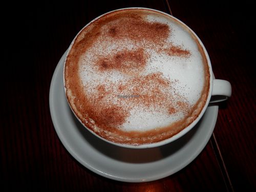Cappuccino topped with cinnamon at Caffe Nero in Peterborough