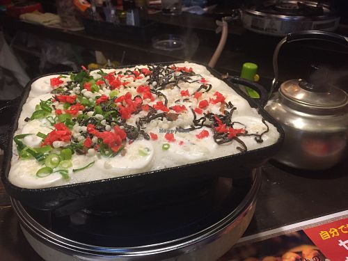 Making Takoyaki  at Self Takoyaki Bar IDUCO in Osaka