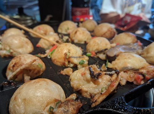 Rotating takoyaki (trying, at least!). at Self Takoyaki Bar IDUCO in Osaka
