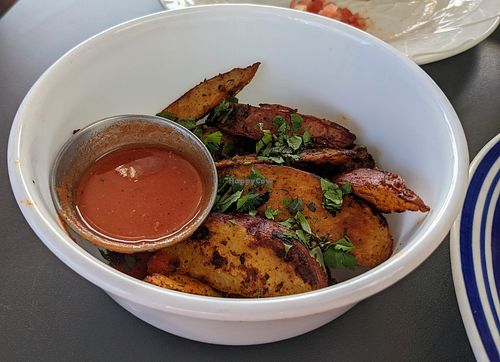 Oven baked potato wedges with homemade ketchup at Moku Roots in Kula