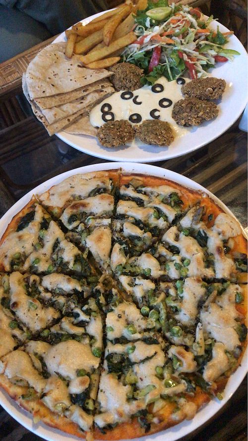Vegan cheese pizza and Israeli plate  at Pumpernickel Bakery and Babylon Cafe in Pokhara