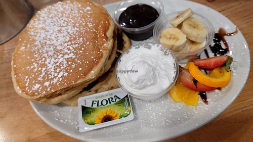 Fluffy American style pancakes with choc sauce and whipped cream and banana at Causeway Cafe in Belfast