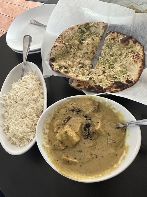 Eggplant curry, garlic naan  at Veggie Crust in Brookline