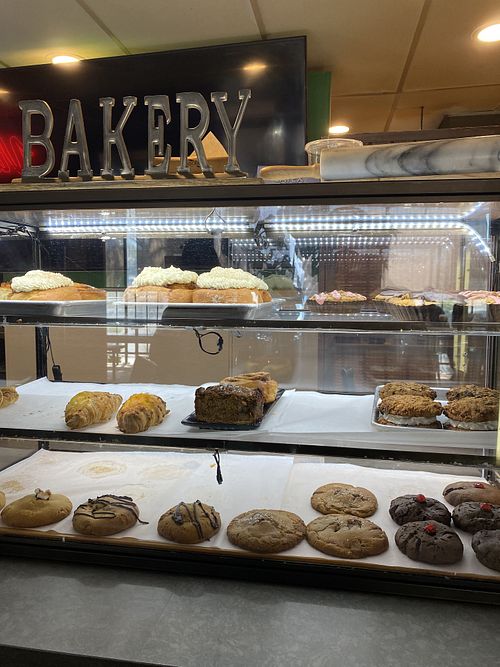 Bakery case, we got a cinnamon roll to-go 😜  at Vida Eatery  in Bakersfield