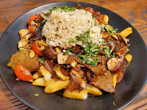 Peruvian dish with fries at Vida Eatery  in Bakersfield
