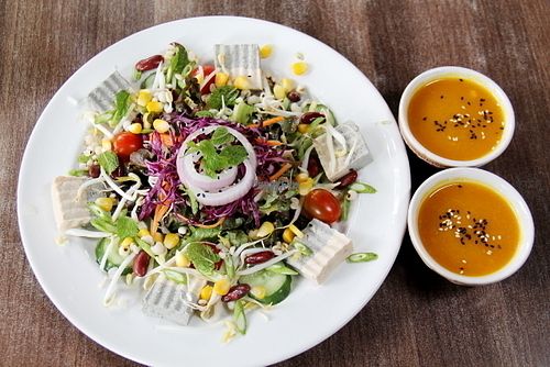 Salad with two portions of dressing (usually one is not enough and I usually have to ask for extra portion).  at Pun Pun Organic Vegetarian Restaurant - Wat Suan Dok in Chiang Mai