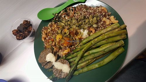 quinoa millet cashew chickpea main with asparagus side, vegan butter sauce, crackers and chocolate banana oat bites for dessert! at San Francisco Wellness Central in San Francisco