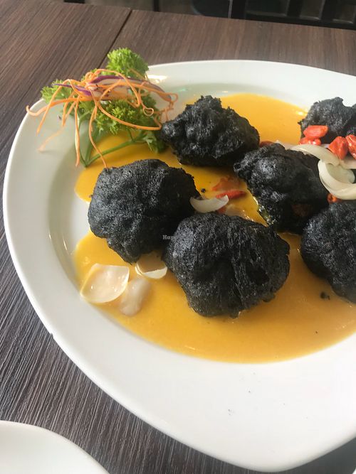 Homemade bamboo charcoal black sesame tofu with pumpkin sauce at New Fut Kai Vegetarian 新佛界素食 in Central Singapore
