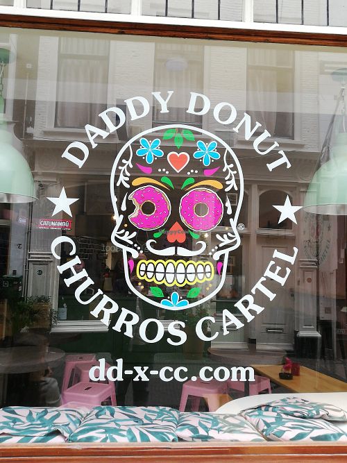 Logo on the window at Daddy Donut x Churros Cartel in The Hague