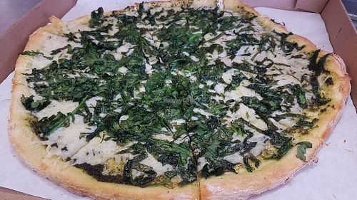 Vegan cheese pizza with spinach and pesto sauce at Abbot's Pizza in Venice