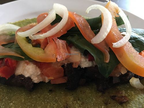 Taco w/ spinach, onion, tomato, tahini at Taqueria Fantasma in Montevideo
