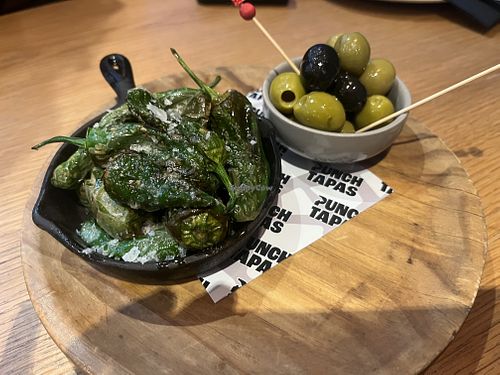 Padron peppers and olives  at Punch Bar and Tapas in Honley