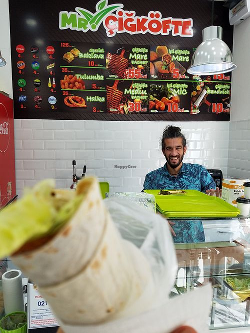 Menu and happy owner at Mr. CigKofte in Bucharest