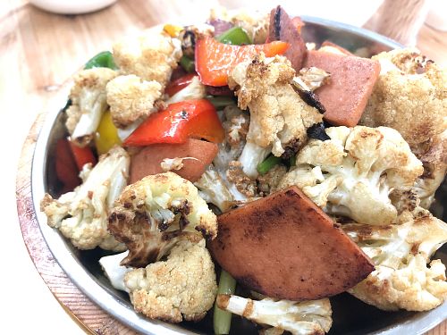 Stewed cauliflower with bell peppers and veg meat at V+ Vegetarian Restaurant in Kowloon
